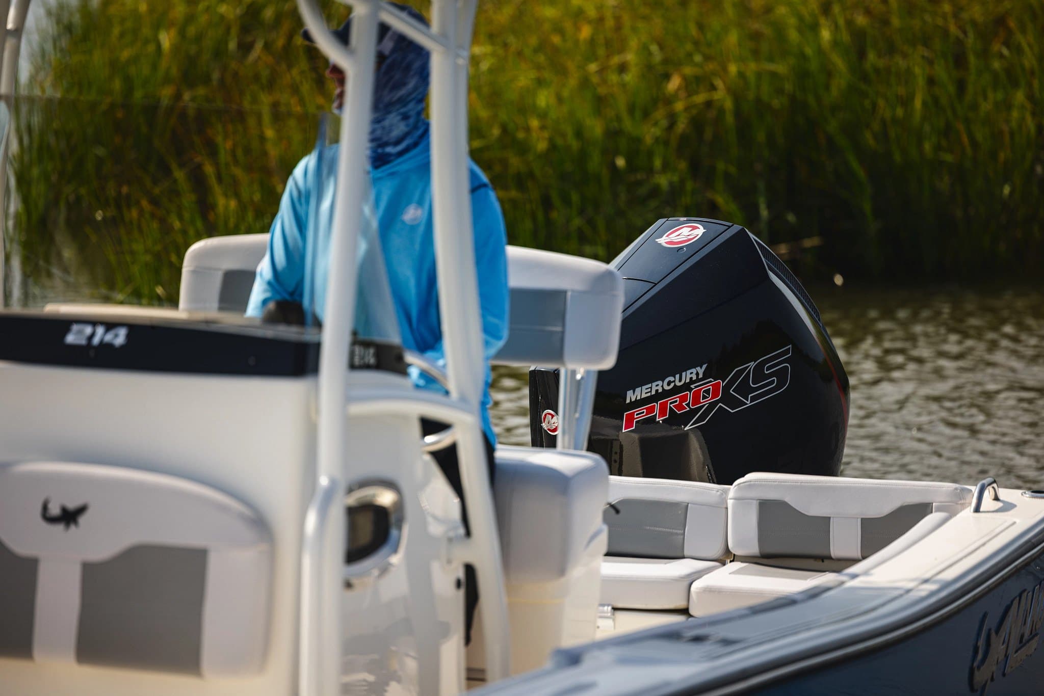 Mercury Pro XS 200 on a center console working the edge of a salt marsh